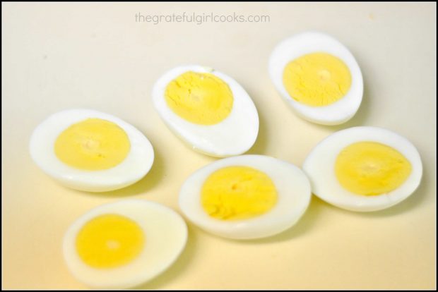 6 hard boiled egg halves on white countertop