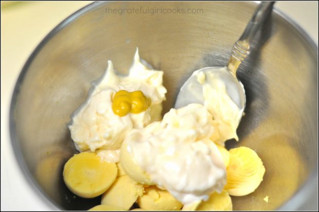 Mayonnaise and mustard added to egg yolks