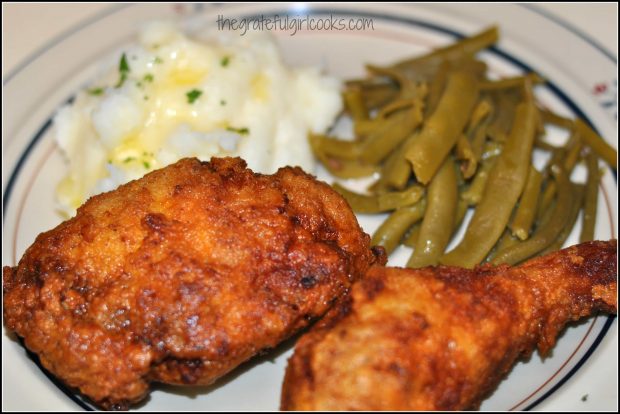 Buttermilk fried chicken on plate with vegetables