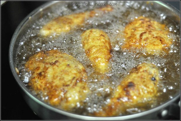 Chicken pieces frying in hot oil