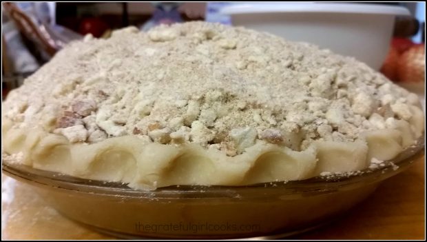 Dutch Crumb Apple Pie / The Grateful Girl Cooks! A side view to see the topping piled up on the Dutch crumb apple pie before baking.