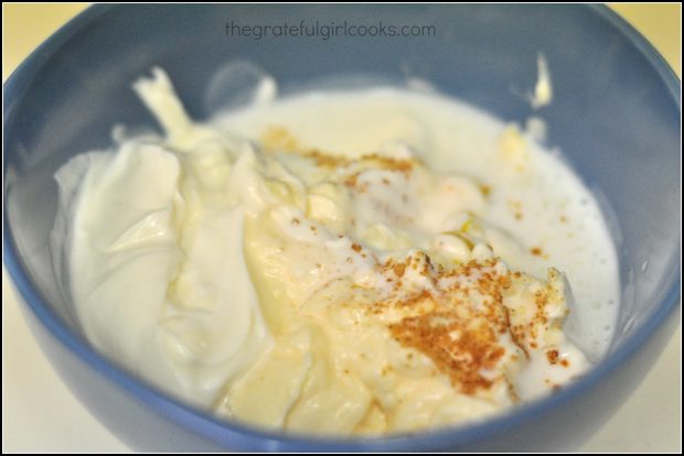 the ingredients for bleu cheese salad dressing are placed into a medium blue bowl.