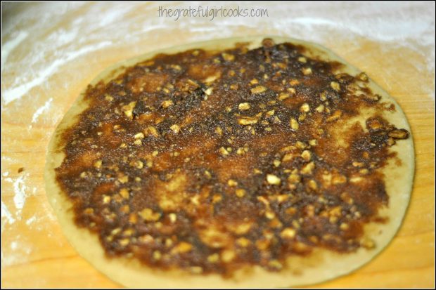 Streusel mixture is spread onto each of the maple twist dough circles.