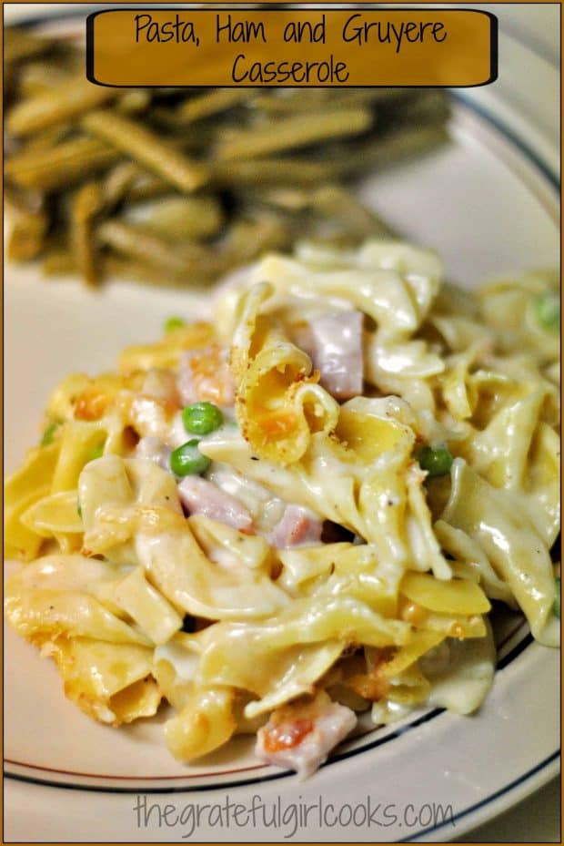 Pasta, Ham and Gruyere Casserole is a hearty, delicious & simple dish, with egg noodles, Gruyere cheese, peas, spices and ham baked in a creamy sauce.