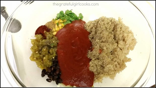 Enchilada sauce is added to quinoa and casserole ingredients.