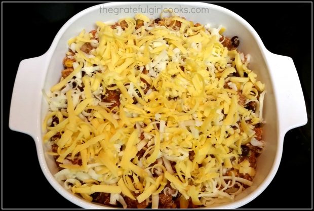 Quinoa enchilada casserole is placed into an 8x8 baking dish