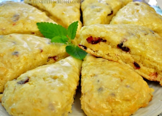 The finished cranberry orange scones, with a mint leaf garnish, ready to eat!