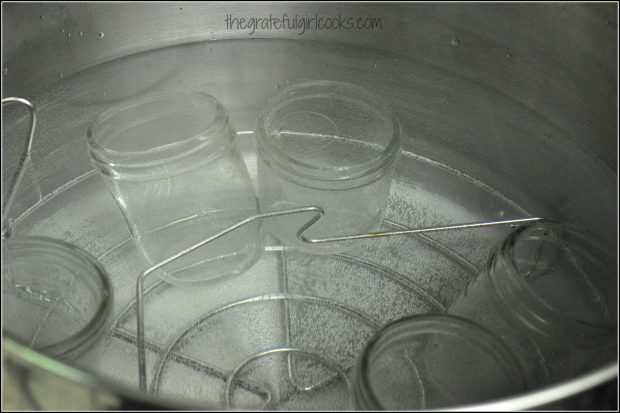 Simmering canning jars before filling them with blueberry jam!