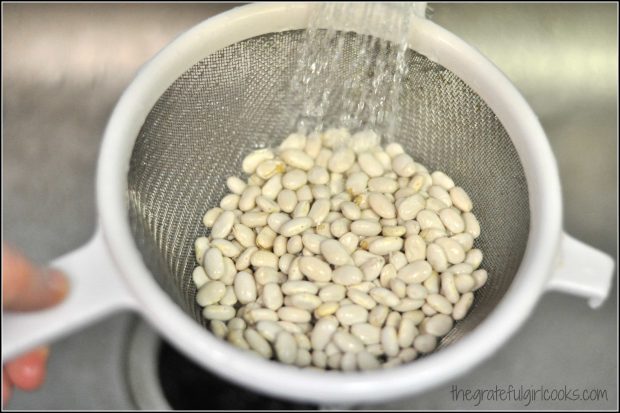 Ham and Bean Soup (and how to CAN it!) / The Grateful Girl Cooks! White colander with beans being rinsed in water