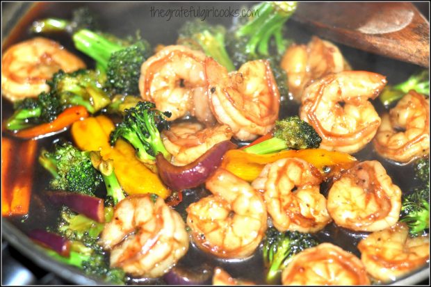 The Asian glazed shrimp and veggies are heated through in the sauce.