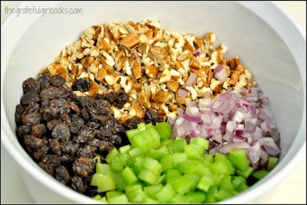Pecans, raisins, red onion and celery ready to add to chicken salad.