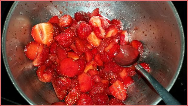 Sliced strawberries in metal bowl, ready to make homemade strawberry ice cream!
