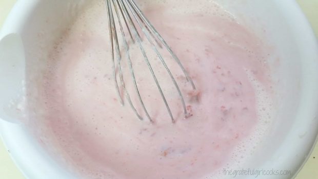 Homemade strawberry ice cream mixture ready to put into machine