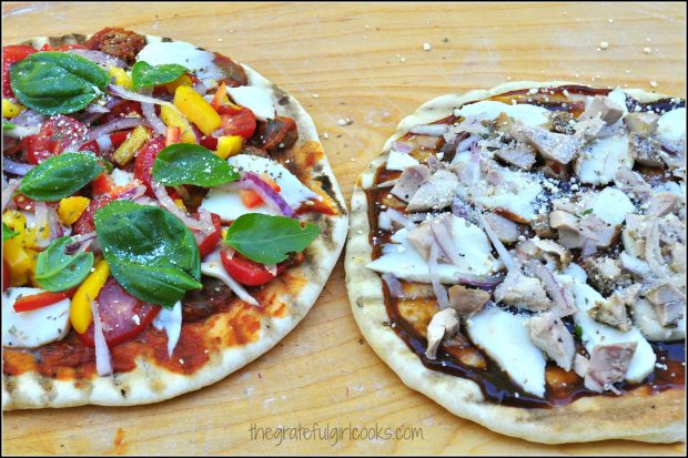 Pizza dough is removed from BBQ and toppings are added, then back onto BBQ grill