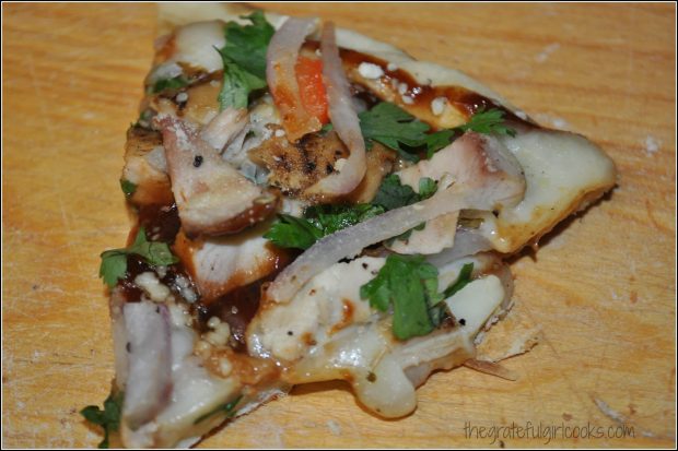 Grilled pizza sliced and served... straight off the BBQ grill!