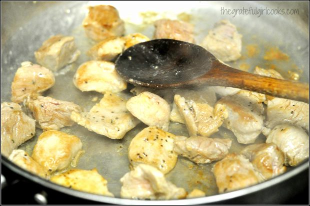 Pork cubes browning in skillet, to be used in pork paprikash.