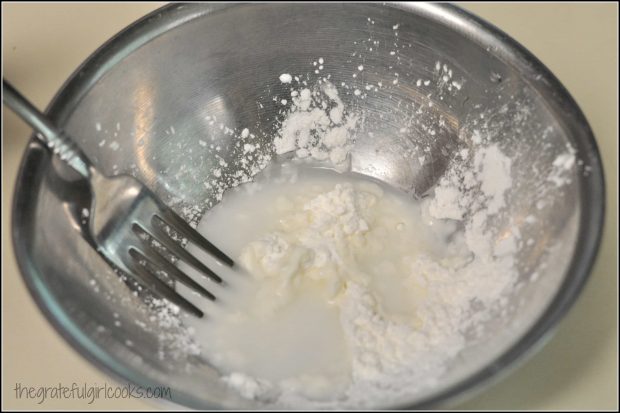 Mixing cornstarch and water in metal bowl, to thicken cobbler filling cobbler