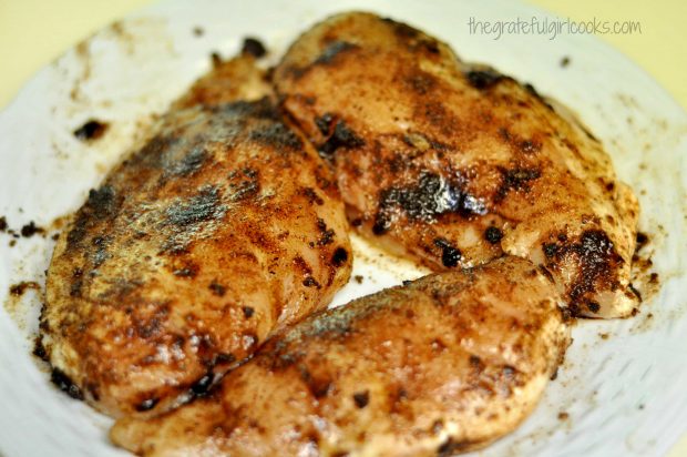 Chicken breasts have been covered with the jerk seasoning mix (combined with oil).