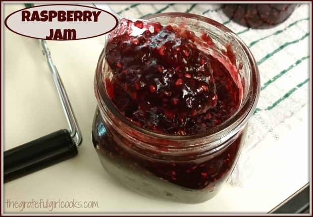 Making homemade raspberry jam and canning jars of it for long term storage is a great way to enjoy the taste of fresh summer raspberries all year round!