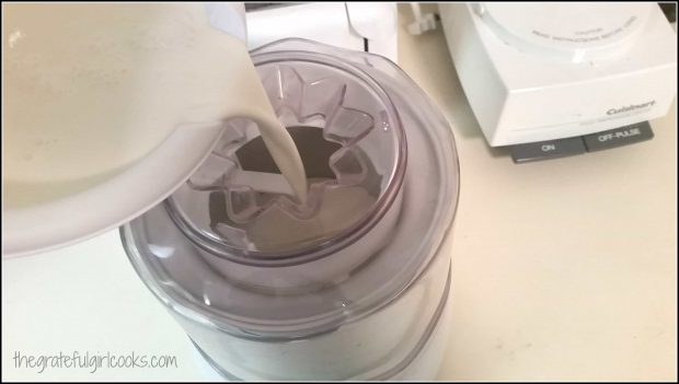 Ice cream base is poured into machine for freezing.