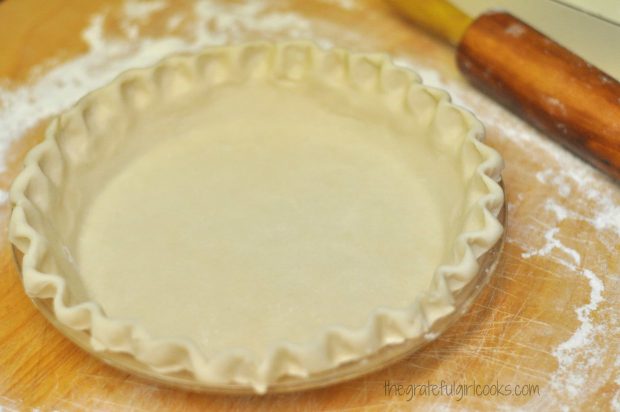 Preparing the pie crust to make a boysenberry pie.