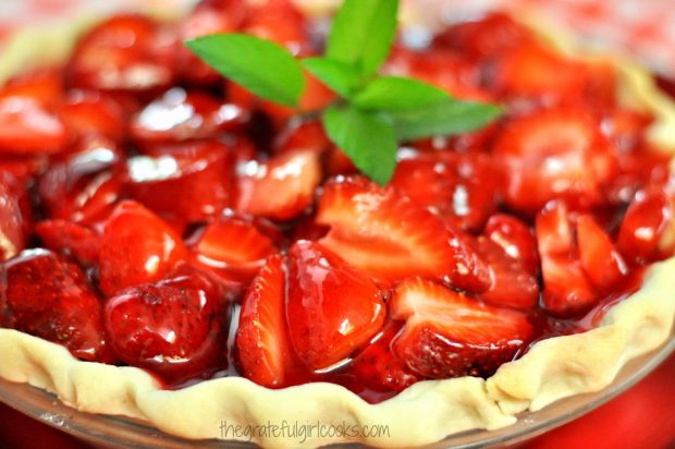 Strawberry Pie with fresh sprig of mint garnish on top.