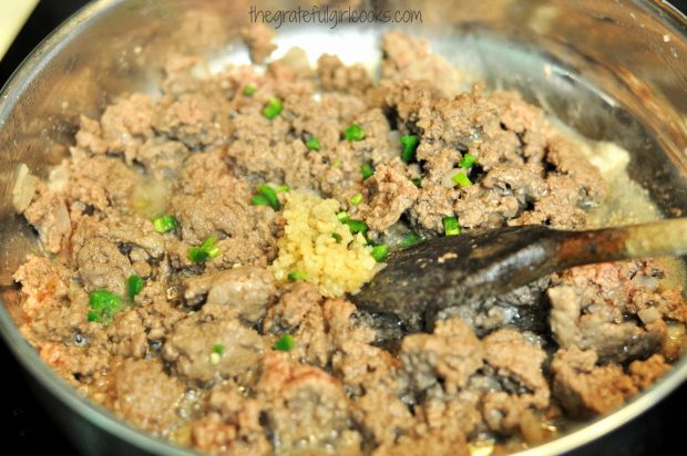 Ground beef, onions, garlic and jalapeno are cooked for chili mac