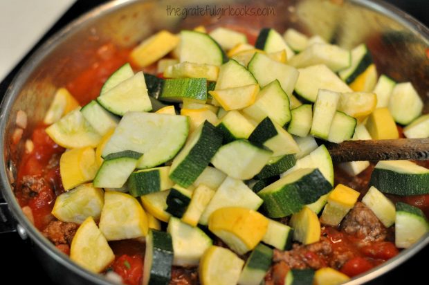 Sliced summer squash is added to chili beef mixture