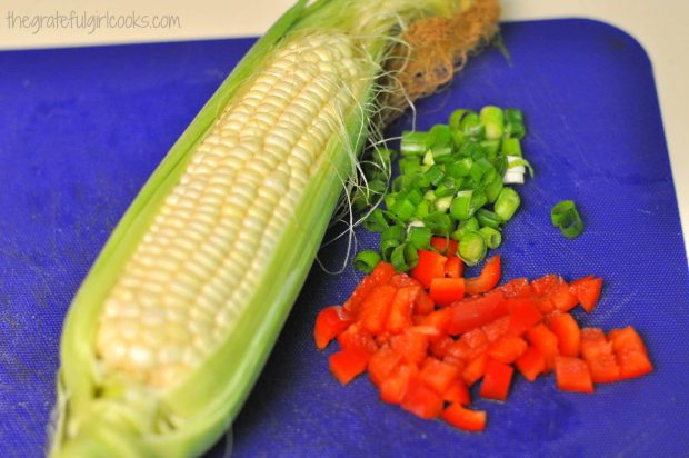 Corn, red pepper and green onions ready to cook