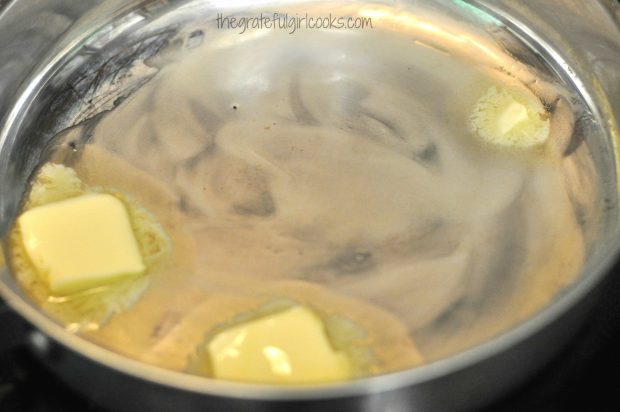 Melting butter in large skillet, to saute corn