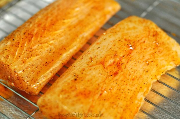 Two pieces of mahi mahi on wire rack