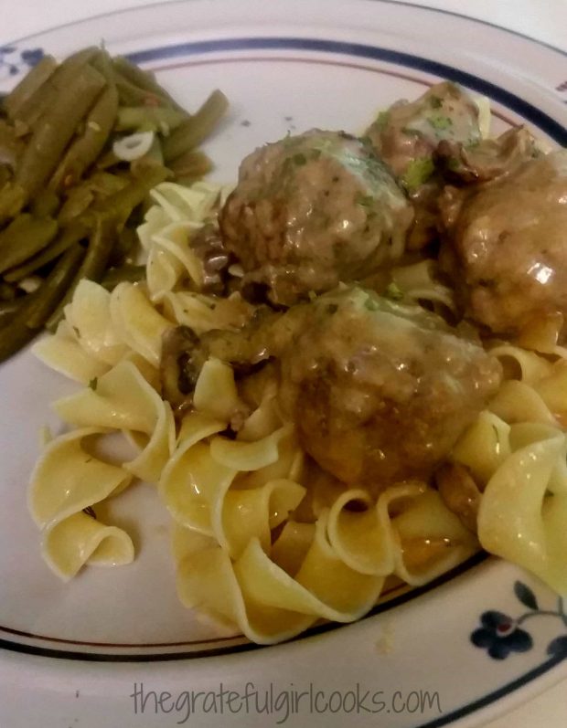 Meatballs stroganoff is served on top of cooked egg noodles