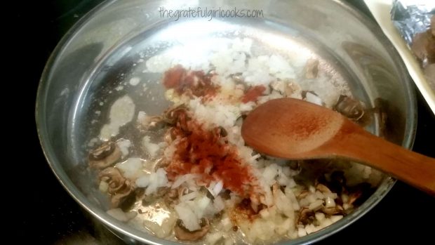 Cooking mushrooms, onions and spices for stroganoff sauce for meatballs
