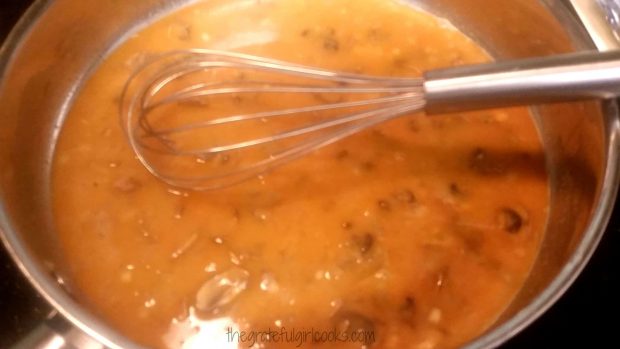 Stroganoff sauce (with whisk) thickens as it is cooked in pan