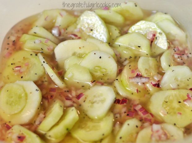 Mom's marinated cucumbers, in bowl in refrigerator