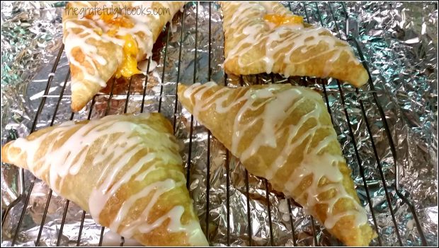 Peach Turnovers are drizzled with glaze once cooled.