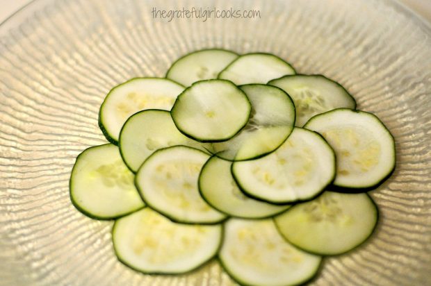 Cucumber, zucchini slices overlapping from center of platter