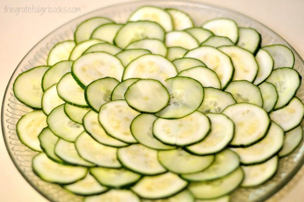 Serving platter with decoratively arranged cucumber and zucchini slices