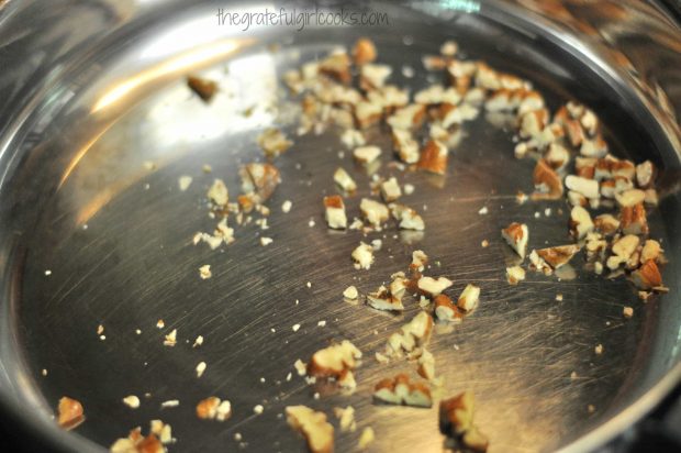 Chopped pecans for salad dry toasting in skillet