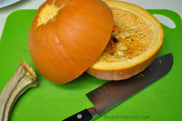 Sugar pumpkins are cut in half horizontally to remove seeds/pulp before making pumpkin puree.