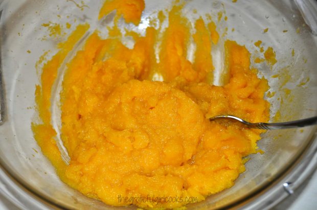 Baked pumpkin is beaten until smooth to make pumpkin puree.