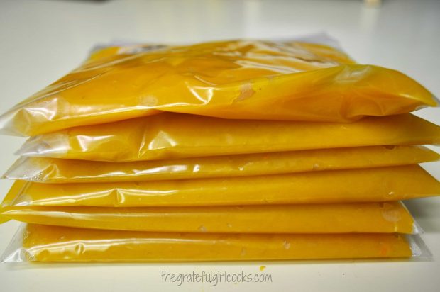 Flattened freezer bags full of homemade pumpkin puree, ready to place in freezer.