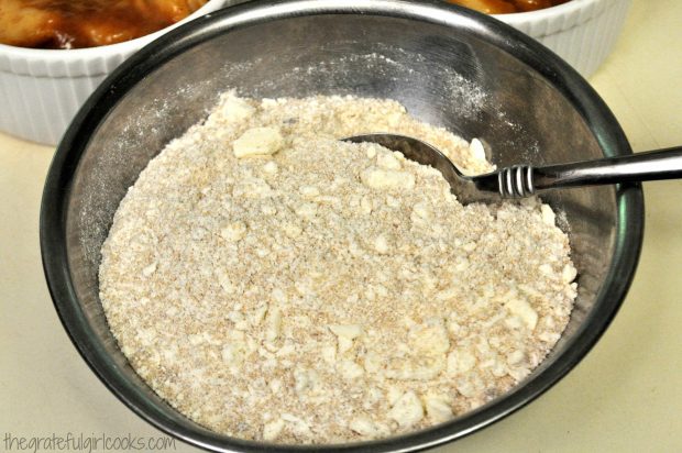 Crumb topping is mixed to add to top of apple crisps.