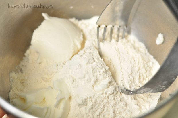 Mixing up the dumplings dough with pastry blender