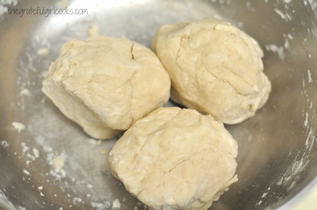 Dumpling dough is separated into 3 equal sized pieces