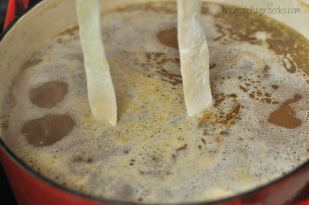 Southern style dumplings are added to boiling chicken and broth