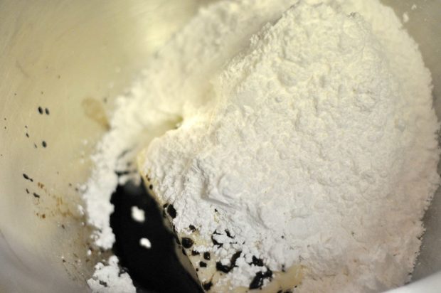 Butter, powdered sugar and maple extract are beaten together to make dough for truffles.