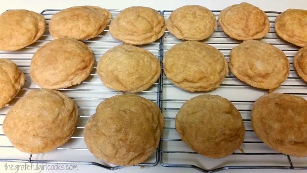 After baking, the pumpkin cheesecake snickerdoodles cool on a wire rack.