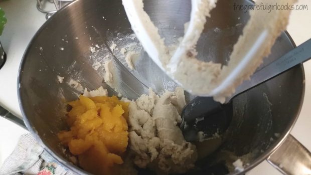 Butter, sugars, and pumpkin puree are mixed together before adding to cookie dough.