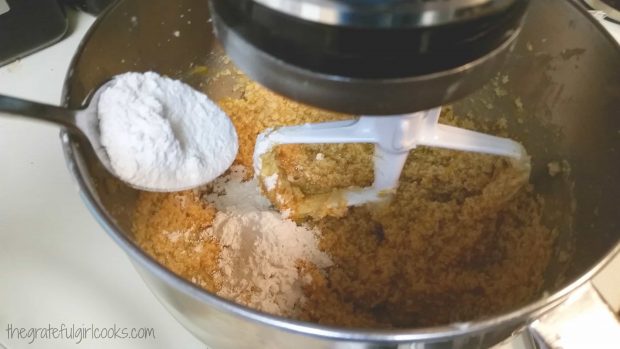 Flour mixture is added a little at a time to the pumpkin batter.